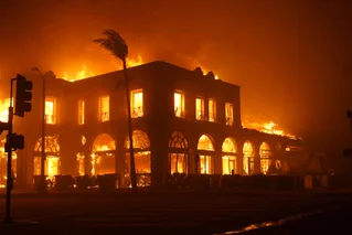 house burning from Palisades fire in Los Angeles