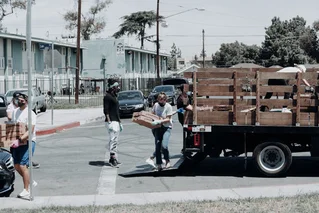 people unloading truck