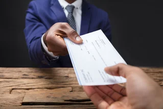 handing over a check