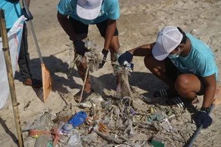volunteers picking up litter