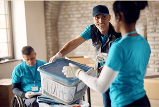 people volunteering at a clothing charity