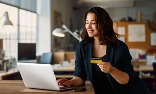 A woman donating online, using her laptop